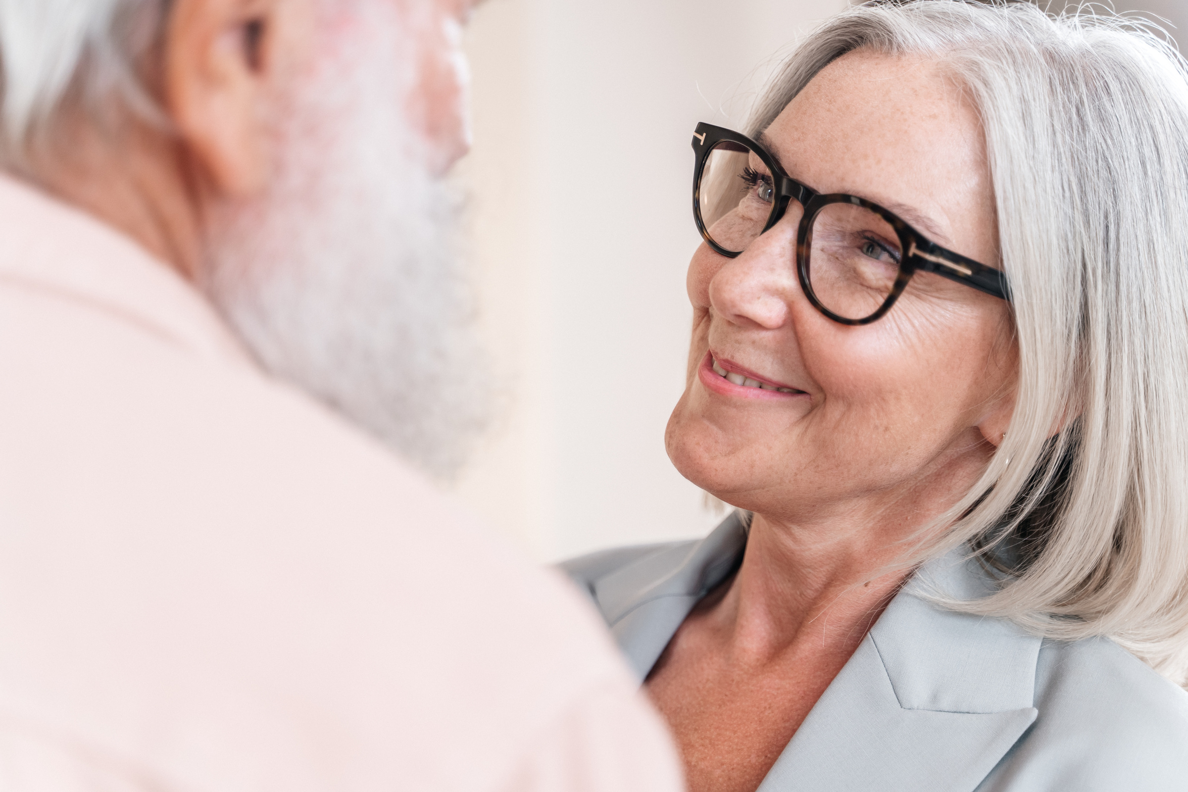 Smiling Woman with Gray Hair in Glasses